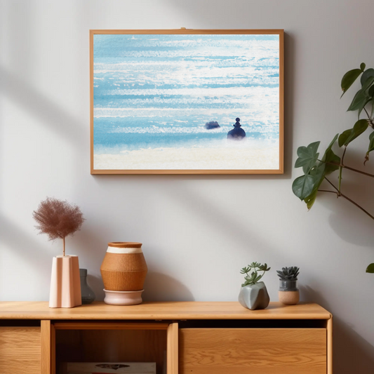 Fine art print of woman sitting on rock, sparkling ocean